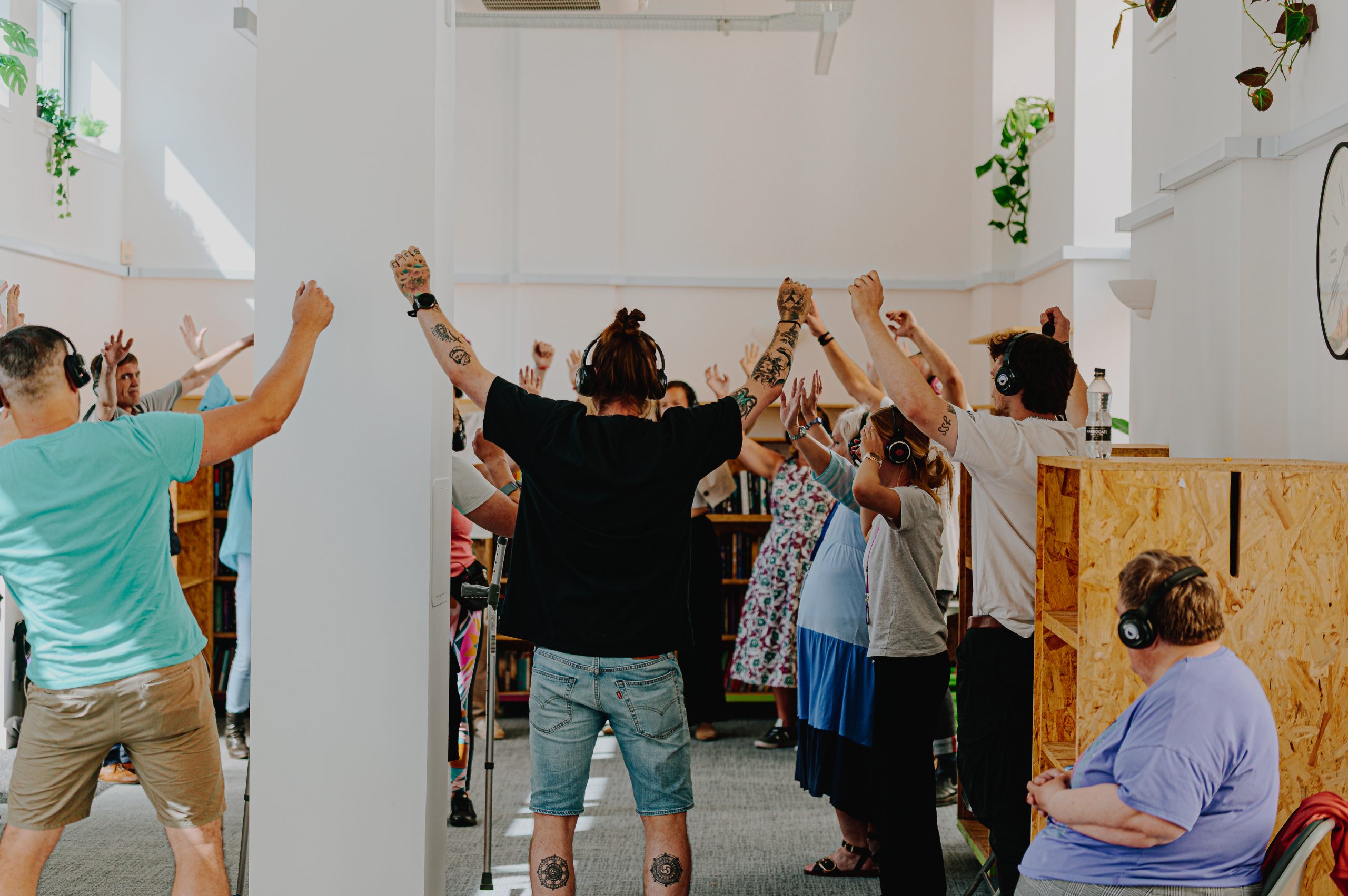 Hands in the air - a recent workshop at Streetreads. Photo by Ben Glasgow.